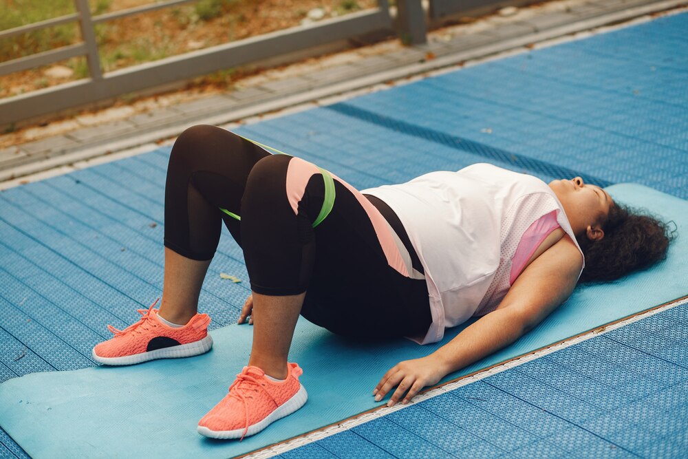 Over the size of a woman doing stretching exercises